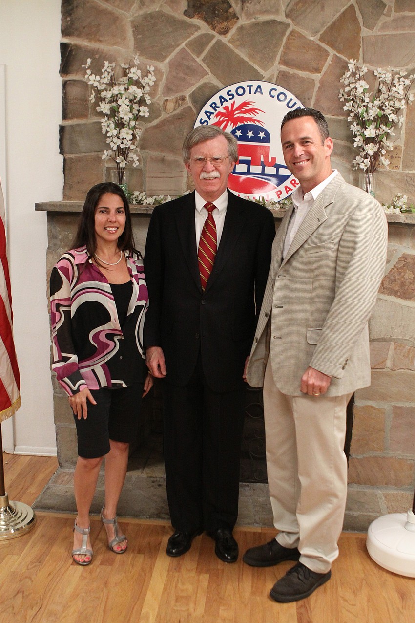 Aya and Roy Sewell pose with John Bolton