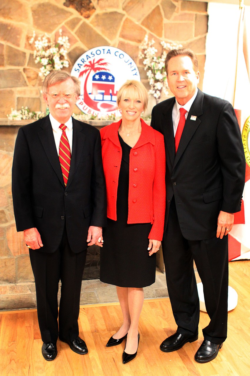 Sandy and Vern Buchanan pose with John Bolton