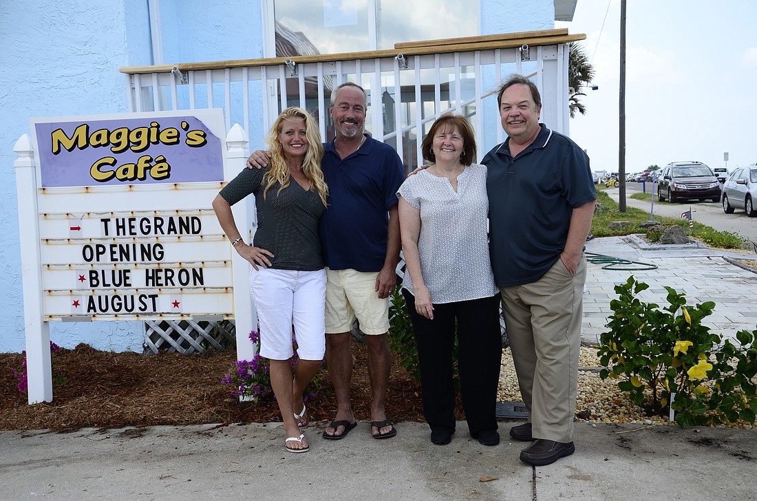 New owners of the Blue Heron Patsy and John Rainey beside previous owners of Maggie's Cafe Maggie and Andy Bochner.