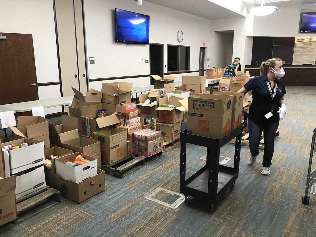 City staff sort and box food donations in City Hall. Image courtesy of the city of Palm Coast