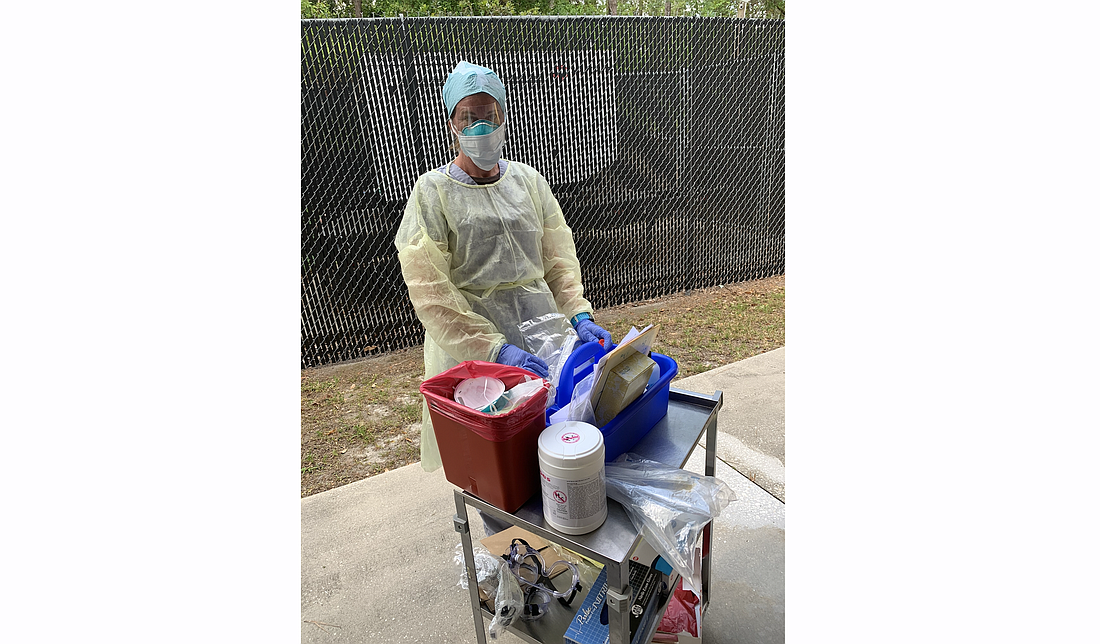 Mel Phillips prepares to test residents for COVID-19. Photo courtesy of the Florida Department of Health-Flagler