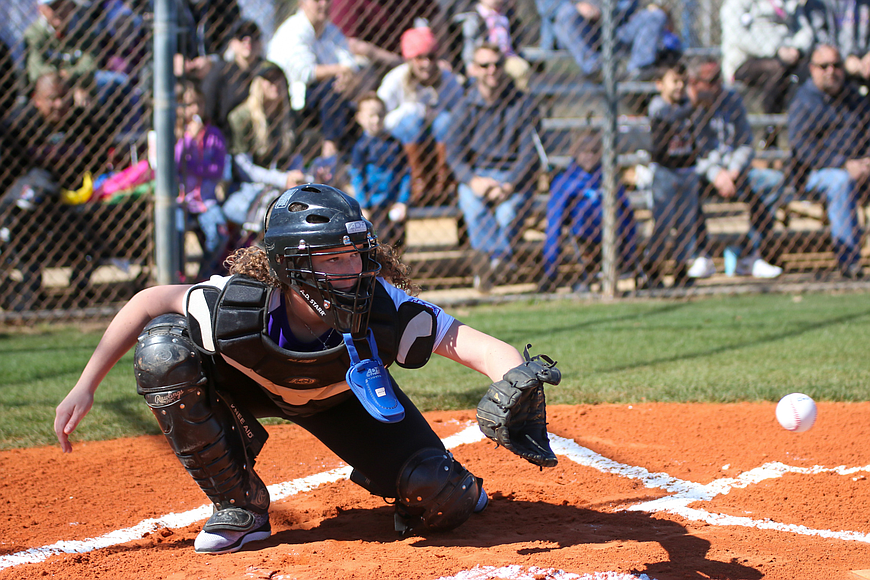 Gabrielle McPride catches a ceremony first pitch Feb. 29, at Palm Coast Little League's opening day ceremony. File photo