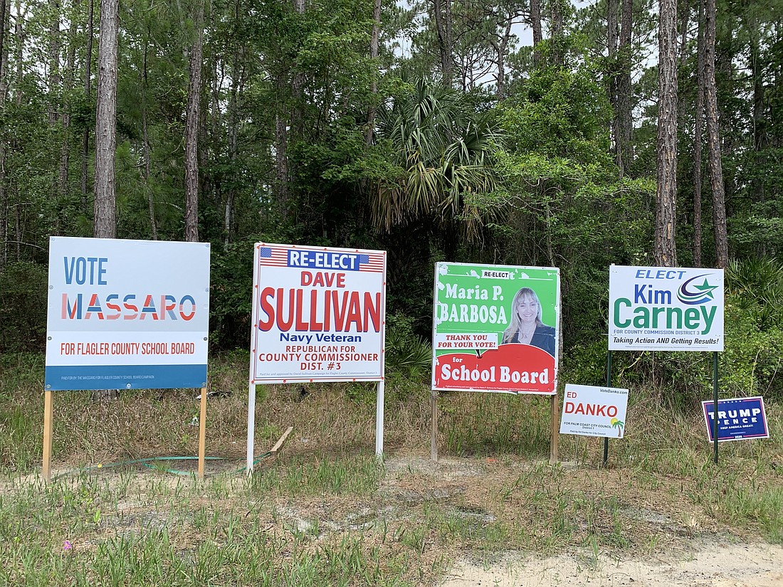 Election signs are popping up, including at the corner of U.S. 1 and Palm Coast Parkway. Photo by Brian McMillan