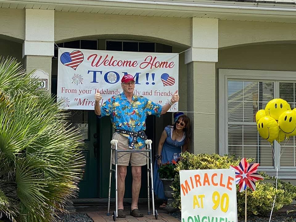 Tom Purcell was welcomed home by his neighbors. County Commissioner Joe Mullins also visited the party to congratulate him. Courtesy photo