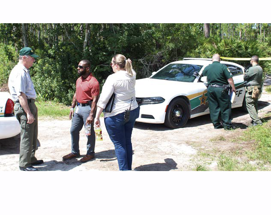 Sheriff Rick Staly speaks with detectives. Photo courtesy of the FCSO