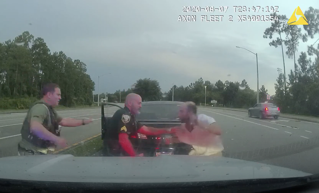 Anthony Petrillo, right, tussles with deputies during a traffic stop Aug. 7. Image from FCSO dash cam footage
