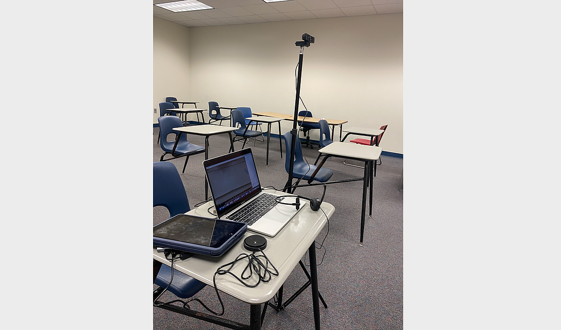 Remote classroom studio kits include: a MacBook, optional iPad, wide-angle HD webcam (USB), lightweight tripod, omnidirectional USB microphone, noise-canceling headphones, and a 16-ft USB cable. Photo courtesy of Flagler Schools