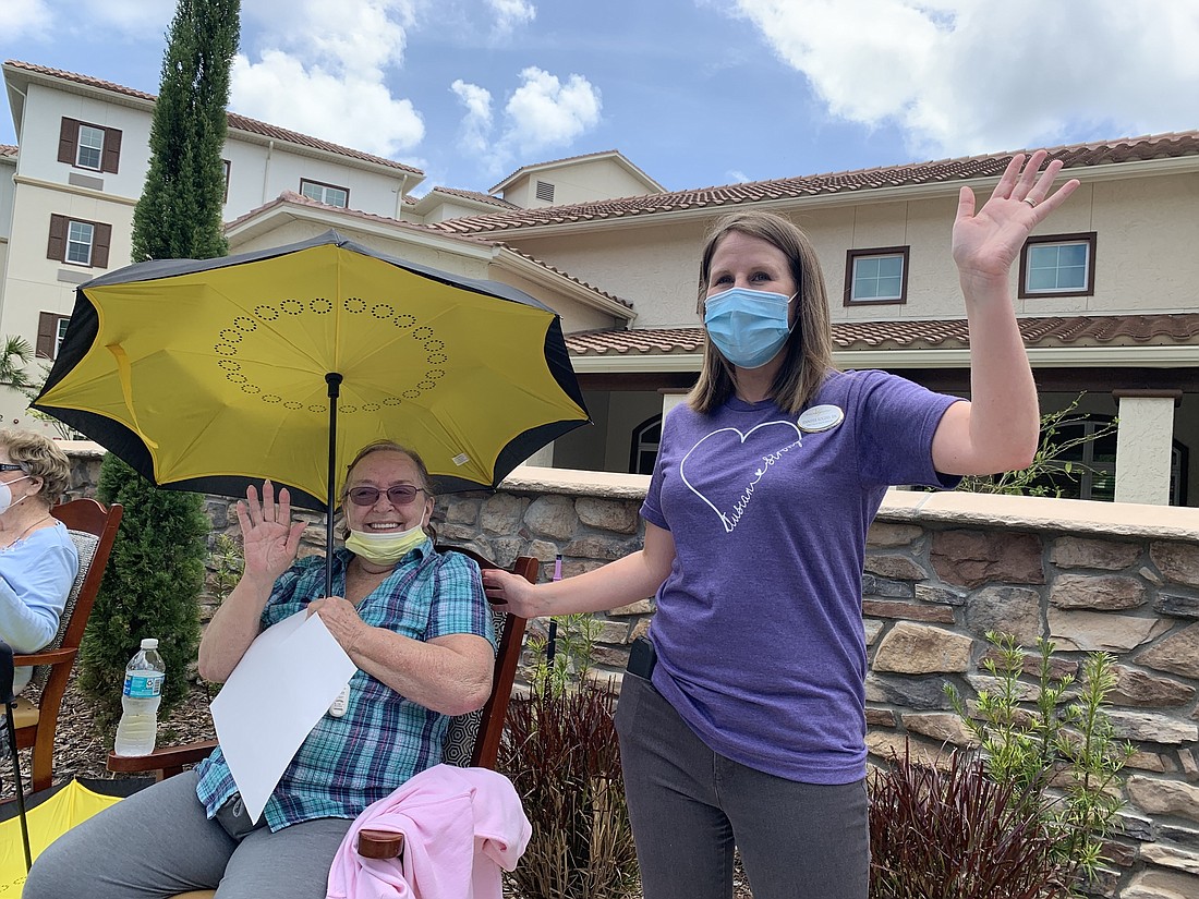 Staff and residents at a recent parade, before visitors were allowed, at Tuscan Gardens of Palm Coast. File photo