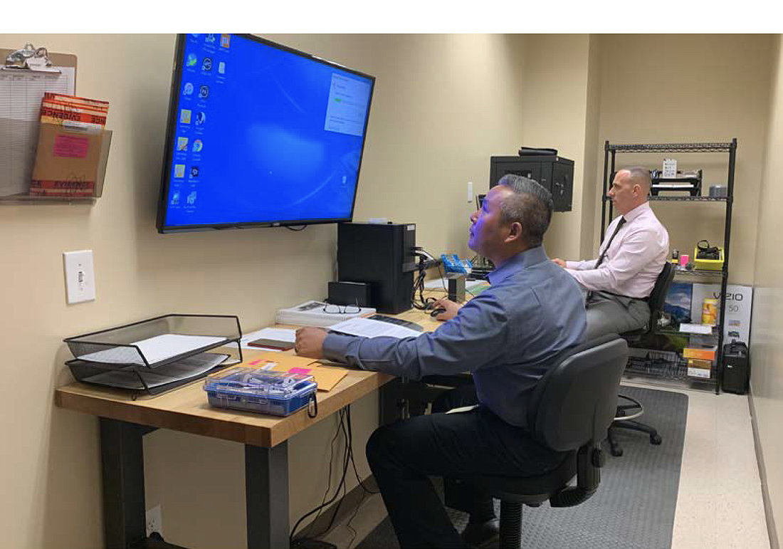 Cpl. Mark Moy, left, and Chief Paul Bovino in the digital forensics room. Photo courtesy of the FCSO