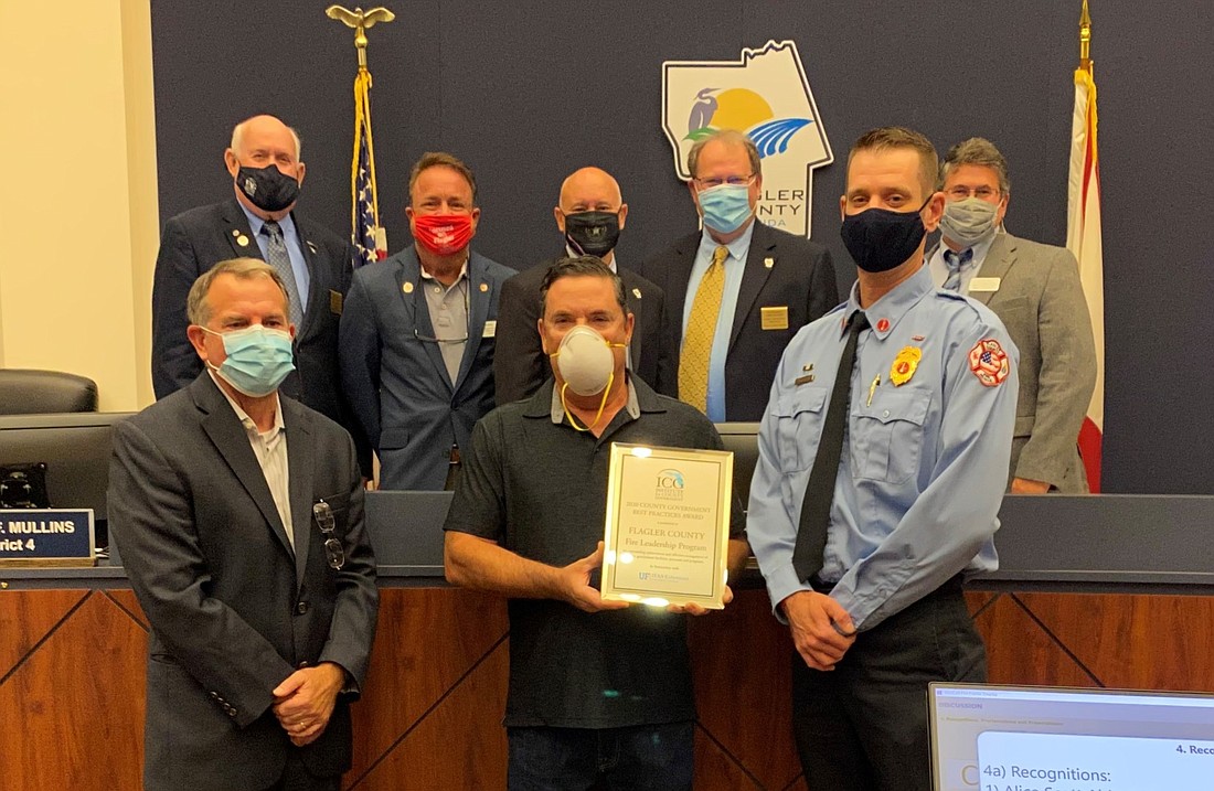 (back row) David Sullivan, Joe Mullins, Donald O'Brien, Greg Hansen, Andy Dance  (front row) Eric Poole (from Florida Association of Counties), retired Fire Chief Don Petito, Lt. Andrew Keppler. Courtesy photo.