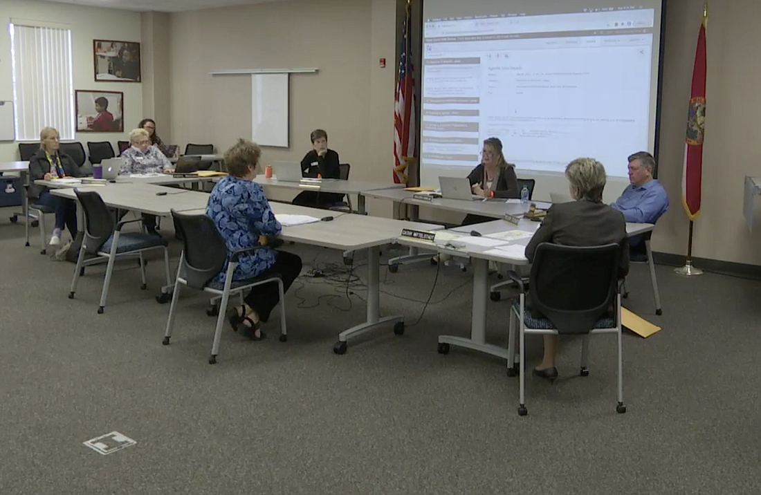 School Board members and school district staff discuss the proposed mitigation agreement. Image from board meeting livestream