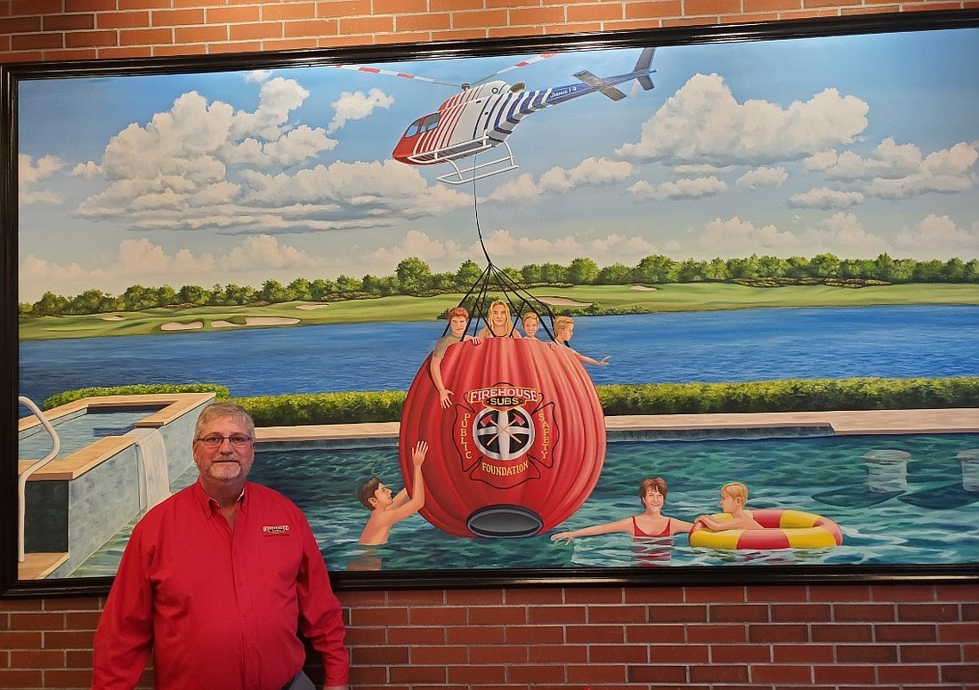 Custom mural at Firehouse Subs featuring Flagler County Fire Rescue's emergency helicopter hovering over owner David Hause's scenic backyard pool. Courtesy photo