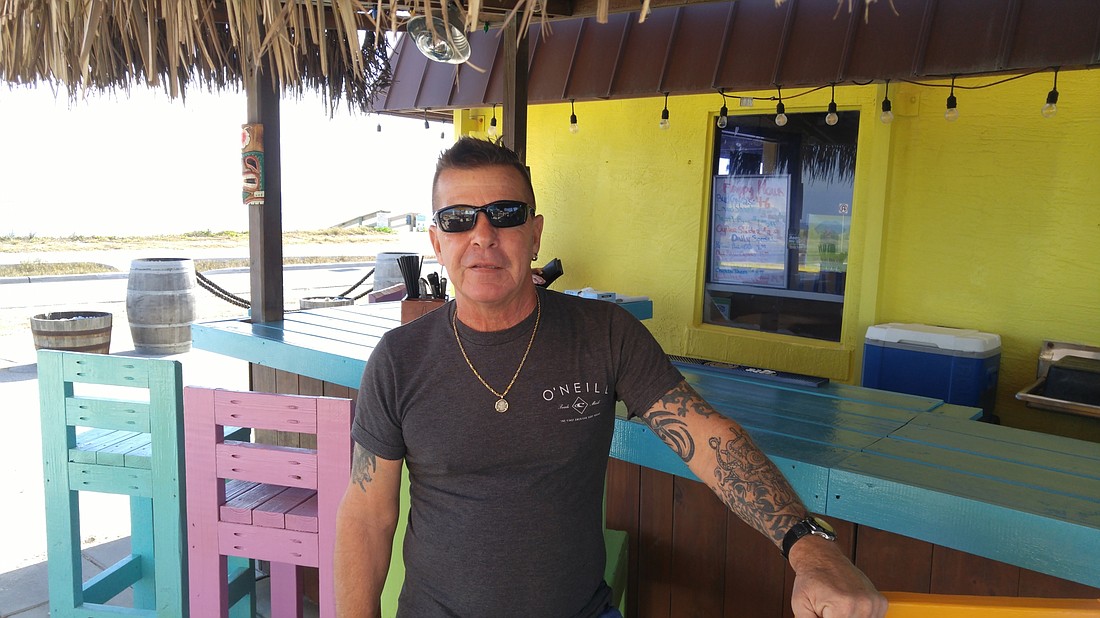 Jim Harris at his restaurant, Jimmy's Hang Ten in Flagler Beach. Photo by Brent Woronoff