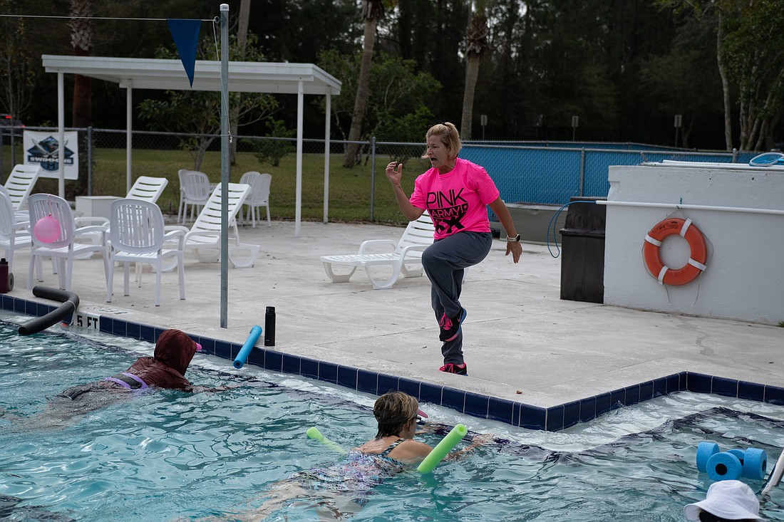 Aquatics instructor Kim White keeps the class motivated on Monday, Feb. 15, at the Belle Terre Swim & Racquet Club. Photo by Jake Montgomery
