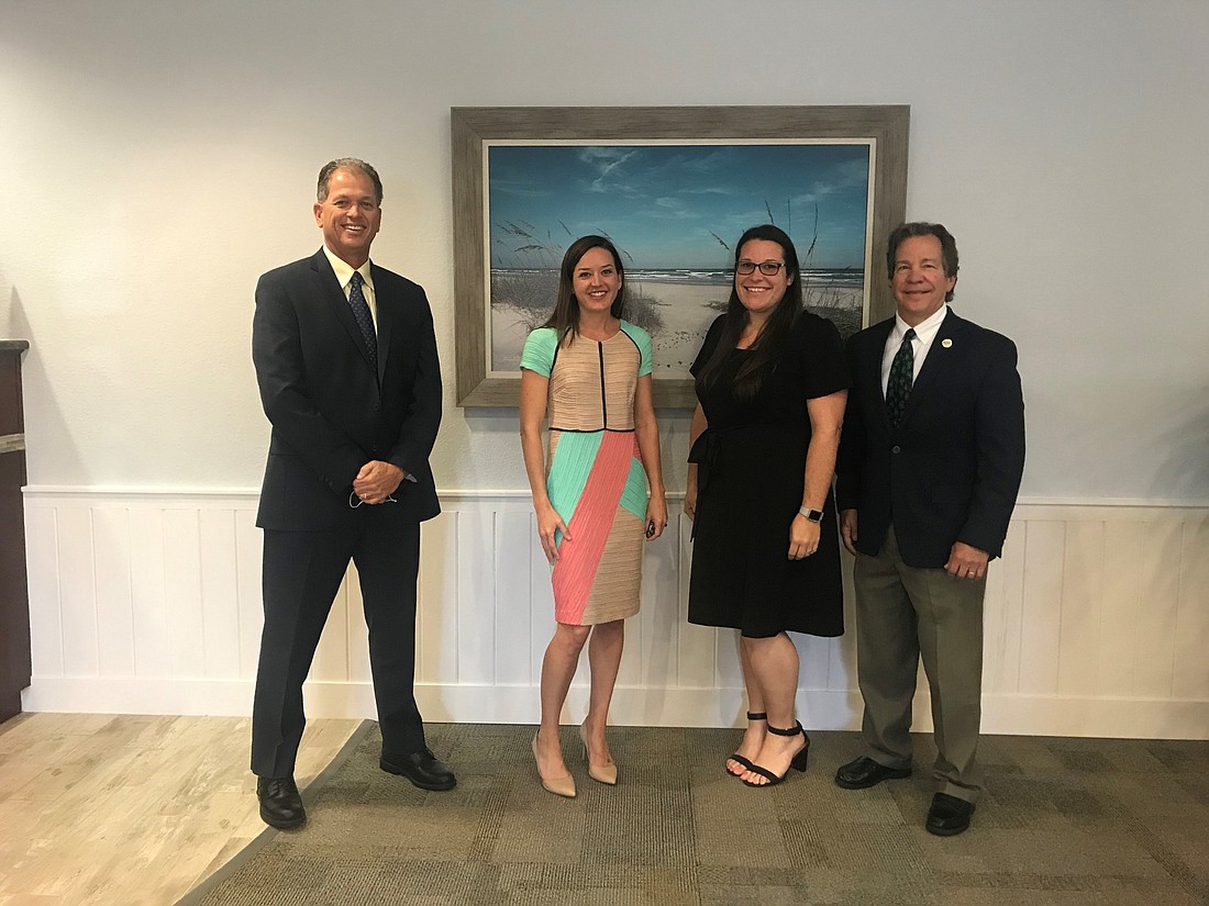 From left to right: Bruce Page, Intracoastal Bank; Kim McBee, UWVFC Board Chair; Courtney Edgcomb, UWVFC President; Phil Maroney, Root Organization. Courtesy photo