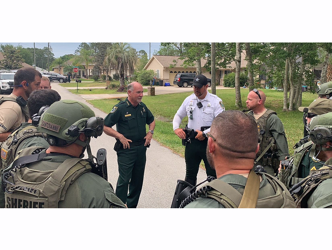Sheriff Rick Staly debriefs with the FCSO SWAT Unit on Breeze Hill Lane. Photo courtesy of the Flagler County Sheriff's Office