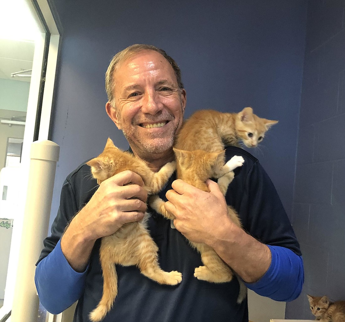 Animal services officer Ray Brown with some kittens that he helped socialize so they could get adopted. Courtesy photo