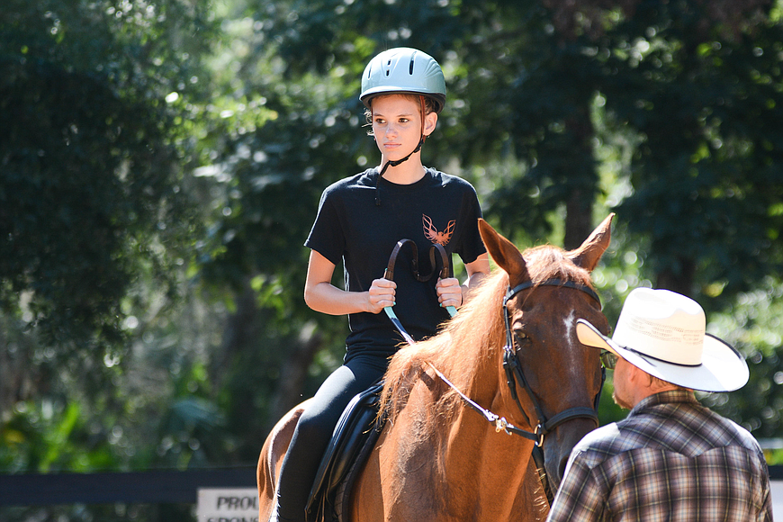 Haley, 13, rides Star, a 20-year-old thoroughbred, at Whispering Meadows Ranch. Photo by Paige Wilson