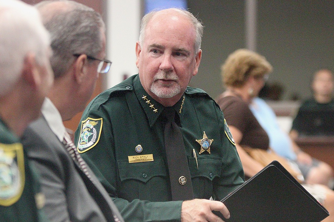 Sheriff Rick Staly speaks with Joe Saviak, the executive director of the Flagler Sheriff's Leadership Institute. Photo by Jonathan Simmons