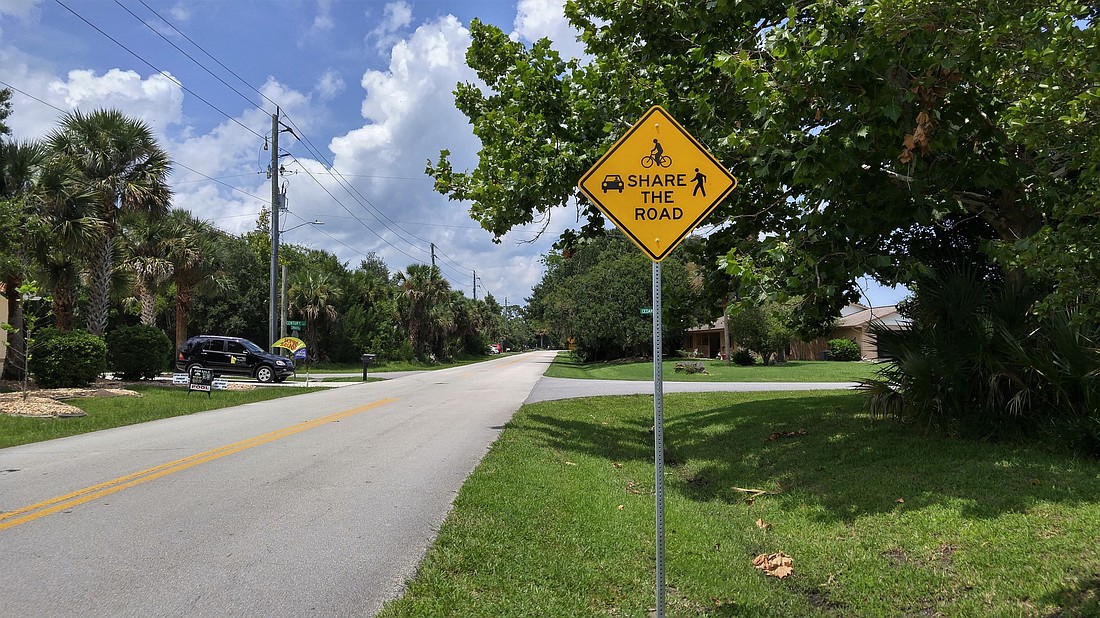 A Share the Road sign on Cimmaron Drive. Photo by Brent Woronoff