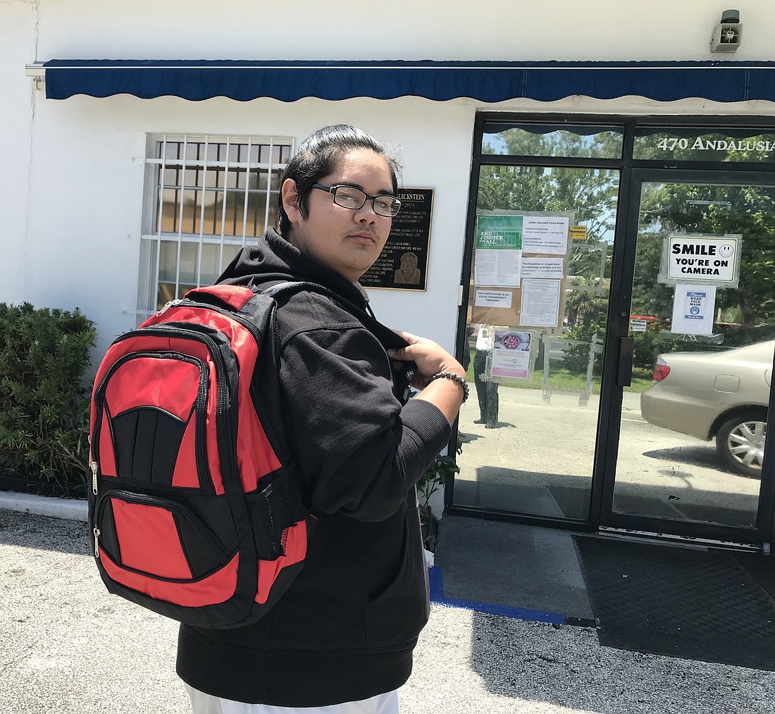 Nathan Velez, 16, shows off one of the 7,000 backpacks. Courtesy photo