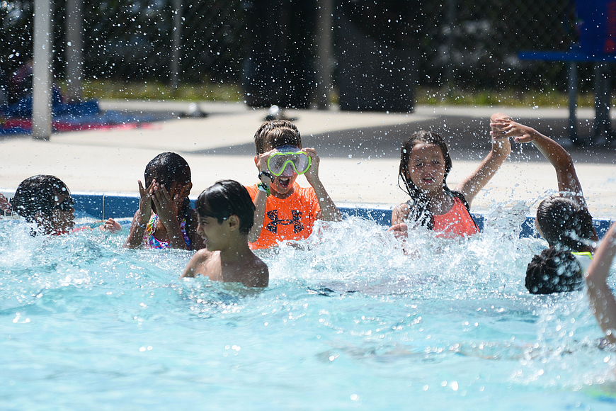 Participants splash around at the end of a swim lesson at the Palm Coast Aquatics Center. File photo by Paige Wilson