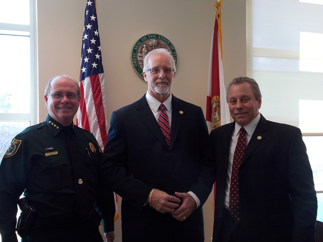 Flagler County  Sheriff's Office Sgt. Nathan Flach, center, was sworn in Monday, Feb. 8, by State Attorney R.J. Larizza, right, with Sheriff James L. Manfre (Photo courtesy of the Flagler County Sheriff's Office)