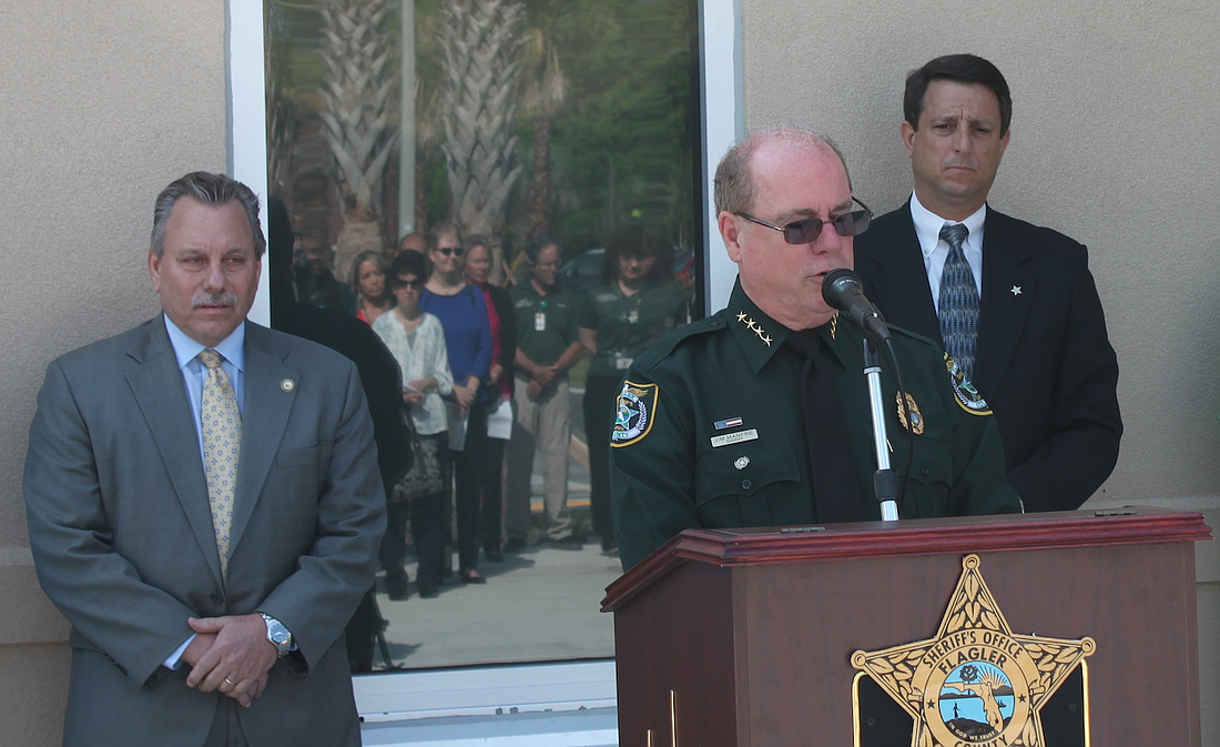State Attorney R.J. Larizza, left, and Sheriff's Office Director Jim Troiano listen as Sheriff James L. Manfre talks about his family's experience when a drunk driver hit his father, severely injuring him, when Manfre was 7. (Courtesy photo)