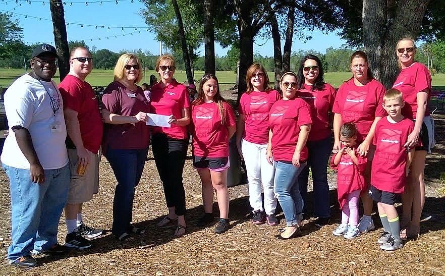 The Children's Home Society of Florida received more that hot dogs and chips at their annual picnic. Bank of America presented them with a $5,000 check. Courtesy photo