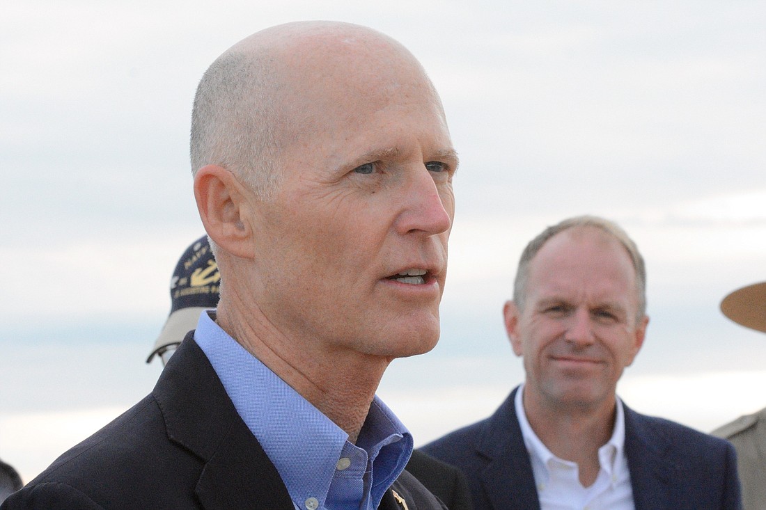 Florida Gov. Rick Scott speaks to local officials and members of the press during a Jan. 27 press conference at Washington Oaks Gardens State Park. (Photos by Jonathan Simmons)