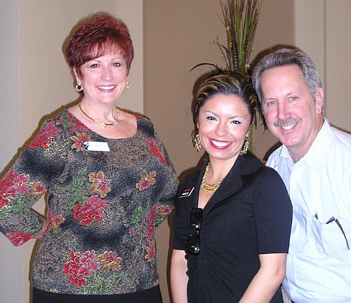 Angela Olmos (center) was Lennar's top salesperson in December and January and she's with Cynthia and Howard Montello of The Montello Agency.