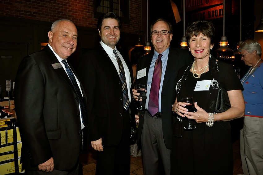 Tom Buchter and Tom Luzier with Marty and Jane Faust