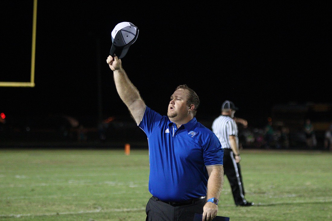 Matanzas head coach Robert Ripley taps his hat to Pirate Nation as the time expired. Photo by Jeff Dawsey