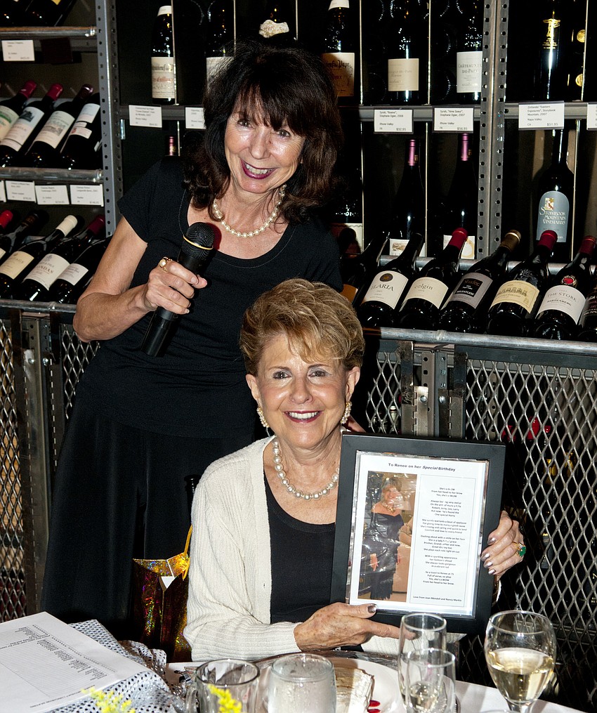 Nancy Markle presenting Joan Mendell's poem to Renee Sheade