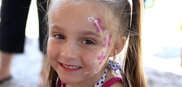 Violet Walsh, 5, had flowers painted on her face.