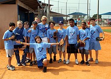 Donna McGarry poses with her team, the 1992 Blue Jays, during their World Series game against the Atlanta Braves Friday, April 29 out at Twin Lakes.