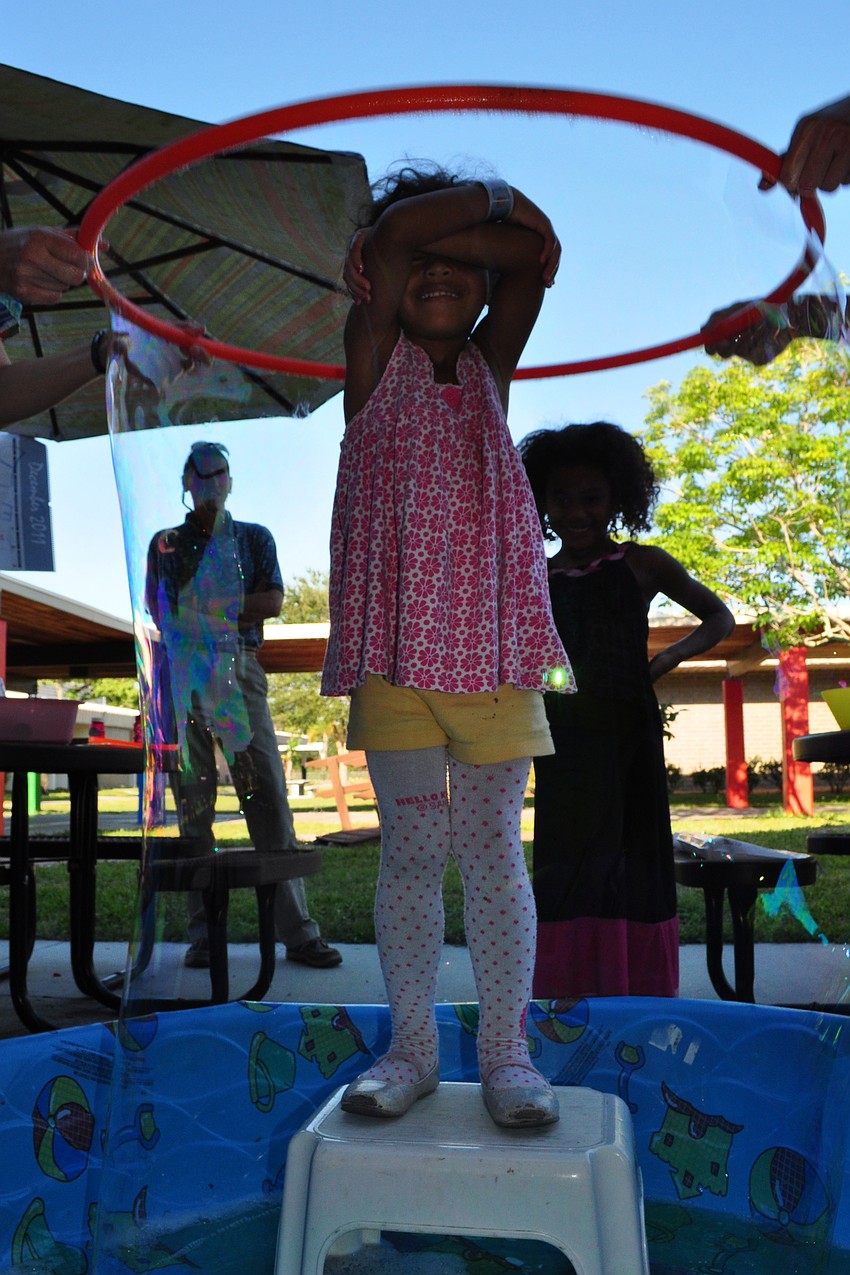 Mya Gaines, 3, was not afraid when the bubble surrounded her.