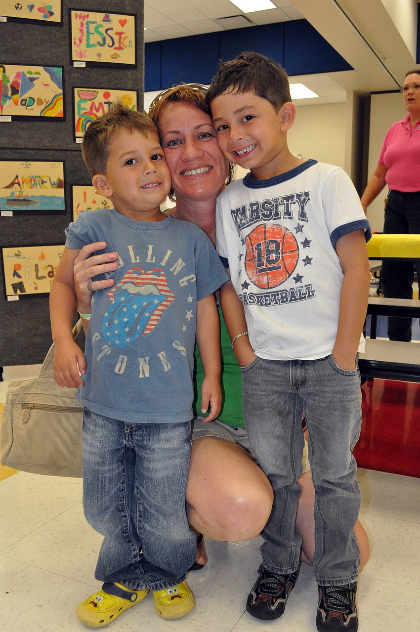 Betsy Serrano checked out the art show with her sons Jeshua, 3, and Dominico, 6.