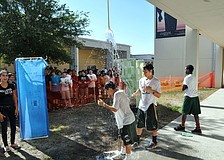 Students were challenged to bathe with only five gallons of water, using their homemade showerheads.