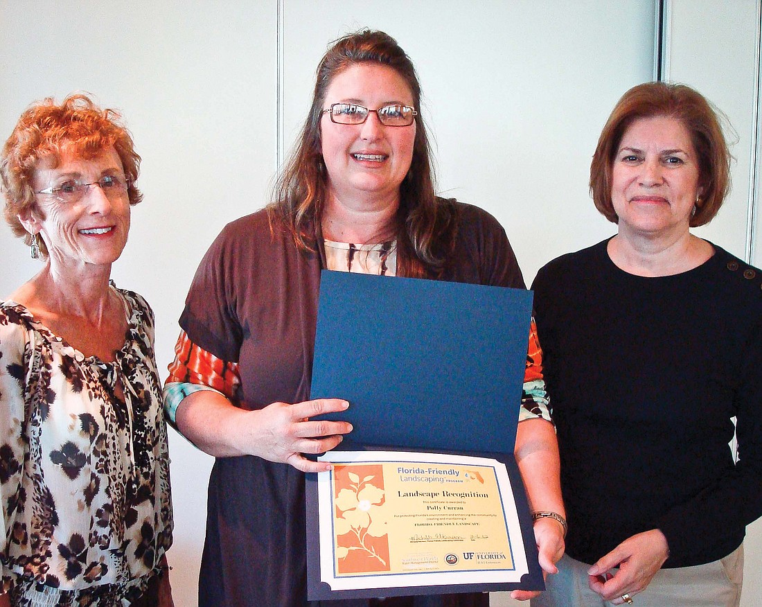 Maureen Hager; Michelles Atkinson, coordinator for Florida Friendly program; and Emily Vosnos. Photo by Polly Curran.