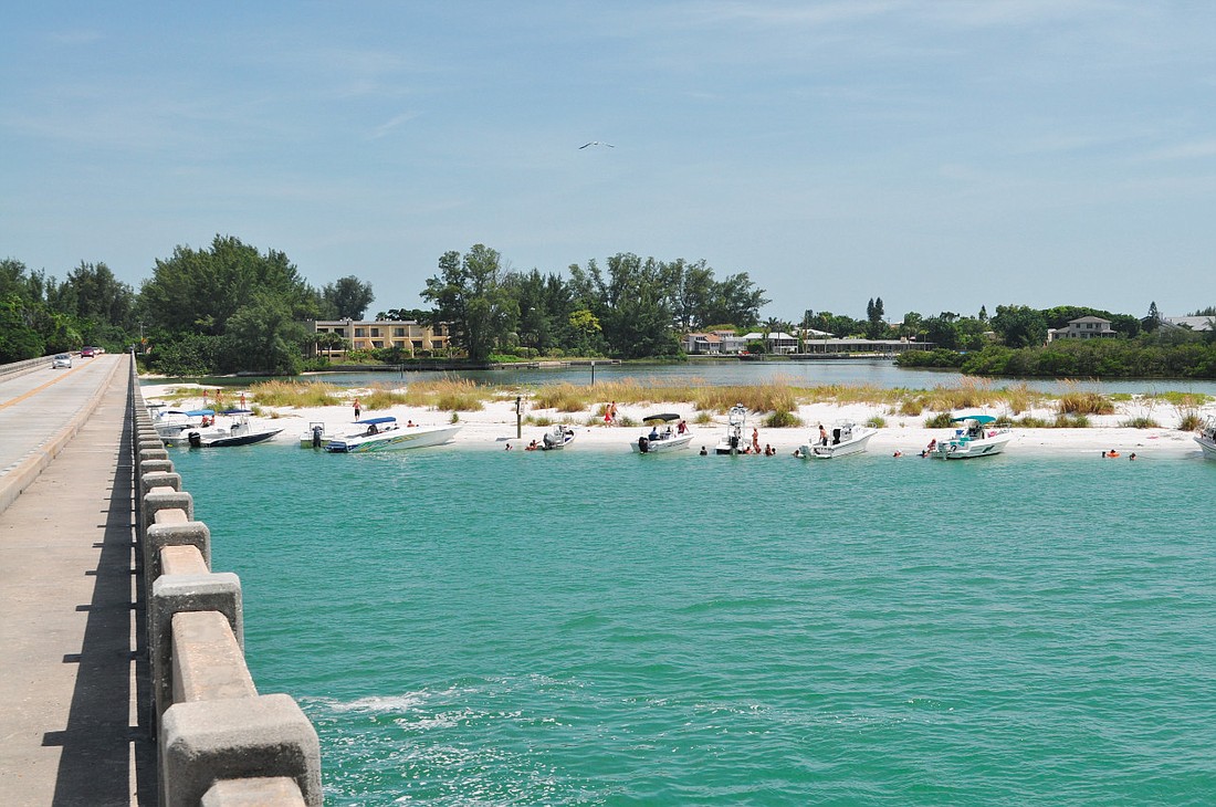 The Longboat Pass Inlet Management Plan calls for installing a terminal groin at Beer Can Island, pictured, and two groins on northern Longboat Key to control Longboat Pass erosion. File photo.
