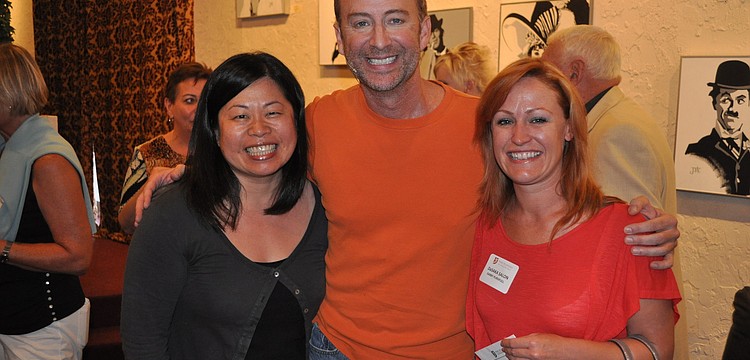 Miko Hosaka and Darby Pursifull of DaSaka Salon pose with Jeffery Kin before the show, Wednesday, May 2, at The Players.