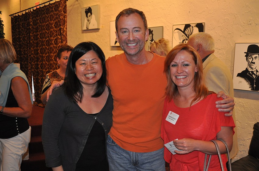 Miko Hosaka and Darby Pursifull of DaSaka Salon pose with Jeffery Kin before the show, Wednesday, May 2, at The Players.