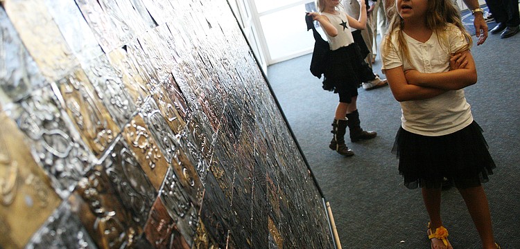 Attendees enjoyed perusing the art display, which featured work from pre-kindergarten through 12th-grade students.