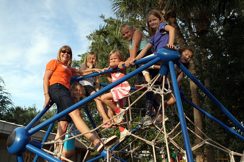 Frances Williams climbed up on the â€œspiderâ€ with some of the students, Saturday, May 5.