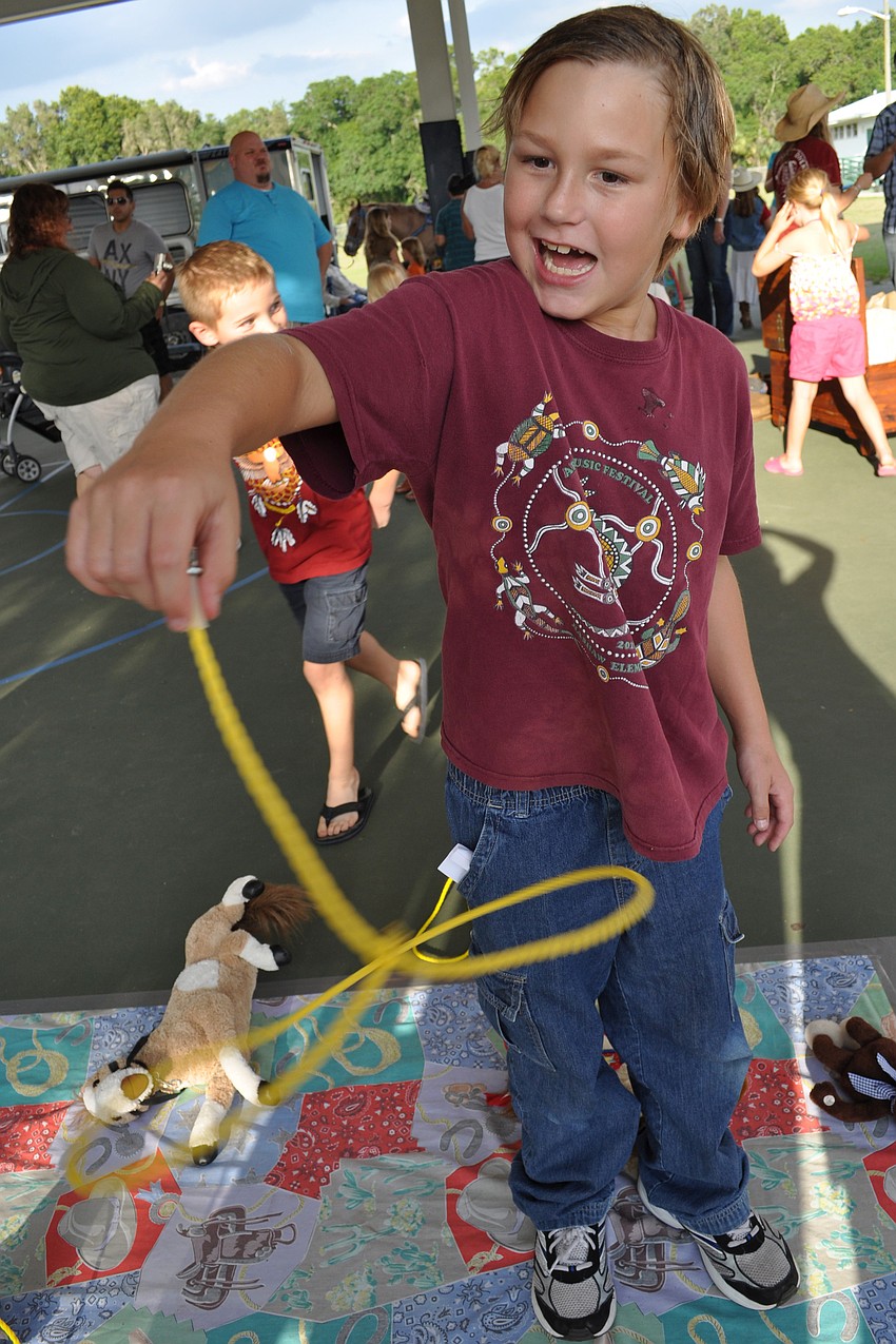 Arik Edstrom, 7, is eager to test his skills with the lasso.