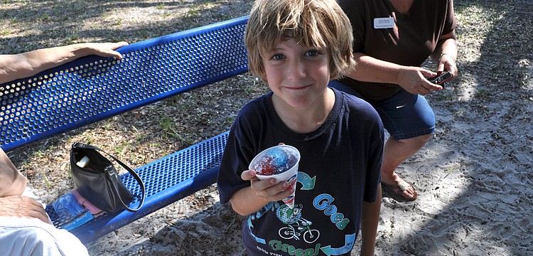 Kai Cameron enjoys a snow cone.