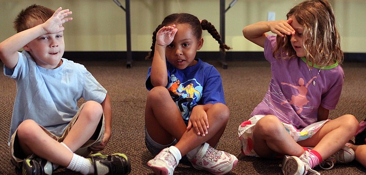 Aidan Oâ€™Callaghan, Franki Magnotti and Chloe Macculoso pretend to look around the room during a song, Wednesday, May 9.