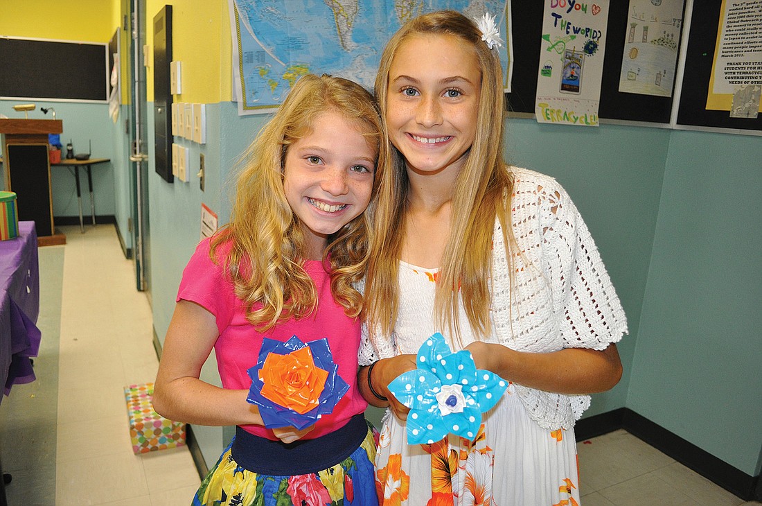 Rachel Weronik and Abby Misiura spent about one month making their duct-tape flowers before launching sales this month.