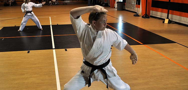 Jazmyn Friedman demonstrates her kata, which is a series of choreographed martial arts techniques.